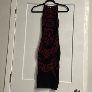 Women’s figure hugging black/maroon dress